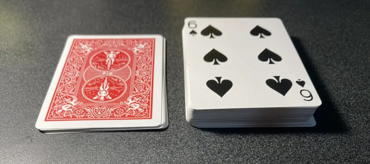 My calendar, viewed from the side to show the relative heights of the piles. The deck is face down on the left, the discard pile on the right.