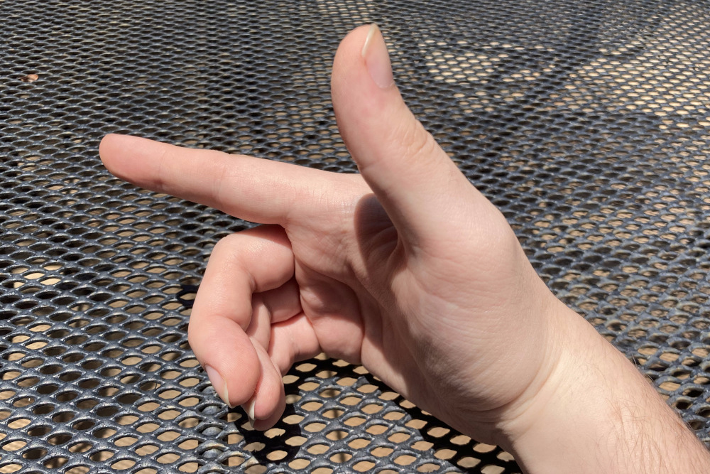 My hand, properly positioned to receive the first chopstick.